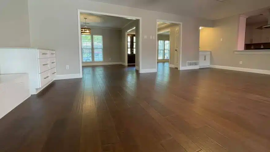 Hardwood and tile flooring installation in North Dallas coordinated with cabinetry and staircase transitions